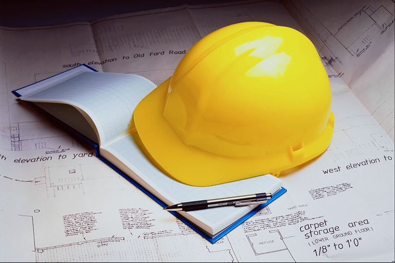 Picture of hard hat and plans